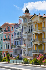 Obraz premium Bright colorful houses in Istanbul Bosphorus coastline. Arnavutkoy is popular, trendy and historical place near seaside. 