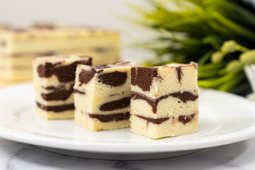 Steamed marble chocolate cheesecake served in white plate