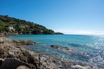 Summer vacation on French Riviera, crystal clear azure blue water of  Mediterranean sea in Saint Clair near Le Lavandou, Var, Provence, France