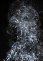 Abstract puffs of smoke on a black background.