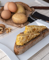 Fototapeta na wymiar Spanish omelette with home baked bread.