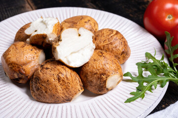 Tasty Italian food, small balls of smoked mozzarella soft cheese
