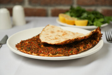 Turkish pizza with minced beef (Lahmacun)