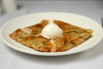 Traditional Turkish dessert with pistachio (katmer) 