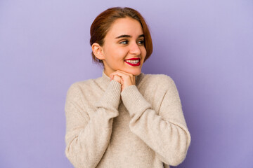 Young arab mixed race woman keeps hands under chin, is looking happily aside.