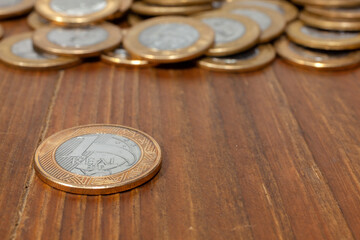 Brazilian Real coin on a wood table
