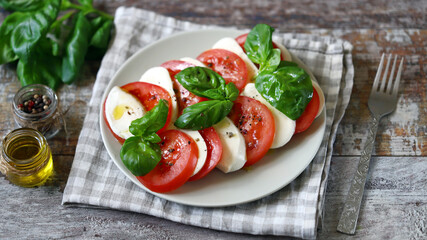 Traditional Italian caprese salad on a plate. Healthly food.