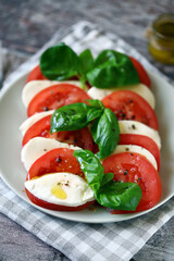Traditional Italian caprese salad on a plate. Healthly food.