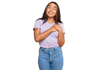 Obraz premium Young latin woman wearing casual clothes smiling with hands on chest with closed eyes and grateful gesture on face. health concept.