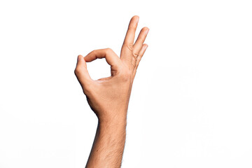 Hand of caucasian young man showing fingers over isolated white background gesturing approval expression doing okay symbol with fingers