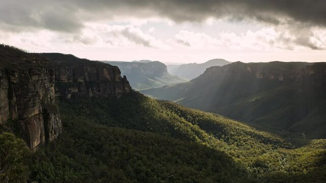 Time lapse looking through canyon in the Blues mountains at Govetts Leap as light beams move through the landscape.