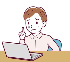 A man in a pink shirt using a computer