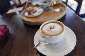 Cappuccino coffee served in a Thai style coffee shop