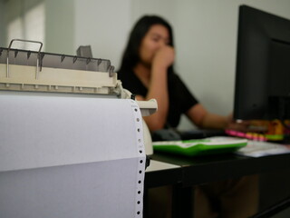 closeup of continuous paper printer in the office.