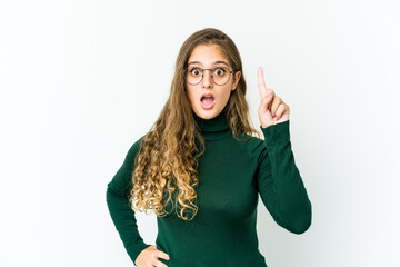 Young caucasian woman pointing upside with opened mouth.