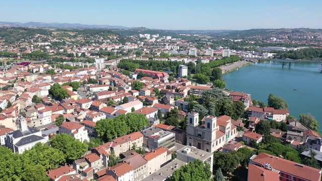 Picturesque view from drone of Givors summer cityscape on Rhone riverbanks, Auvergne-Rhone-Alpes region, France