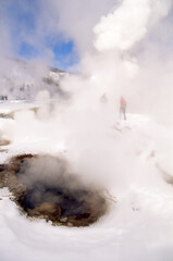 Winter Vacation in Yellowstone National Park - Several visitors are checking out a hot mineral pool