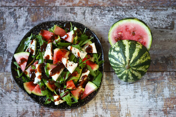 Fototapeta na wymiar Watermelon salad with arugula and gorgonzola cheese. Healthly food. Nice salad.