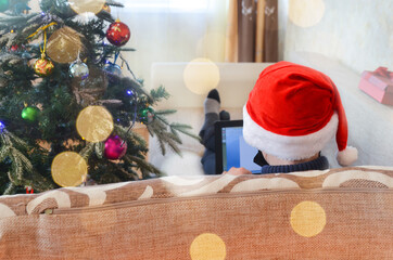 caucasian child working on laptop on christmas holiday indoor, happy new year, lifestyle technology at home quarantine