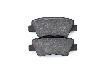 two front brake pads for disc brakes, car spare parts isolated objects on white background, nobody.