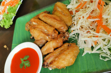 Fried Chicken Wings with Chili Sauce. Thai food.