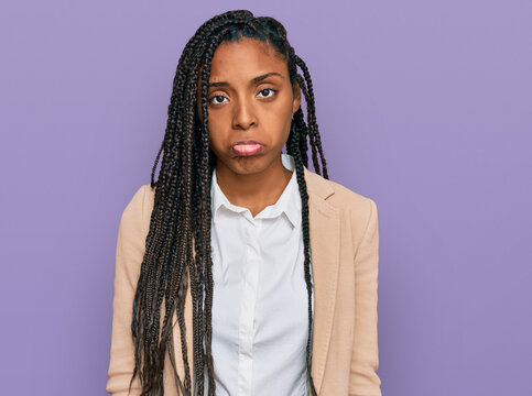 African american woman wearing business jacket depressed and worry for distress, crying angry and afraid. sad expression.