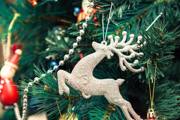 Christmas decorations on tree. Christmas background. Ornaments on tree Christmas