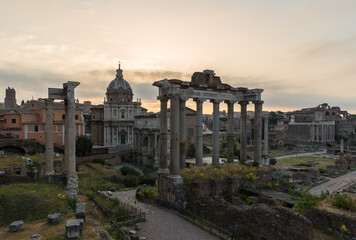Fototapeta na wymiar Sunrise landscapes of the empty Roman Forum, view of the Temple of Vespasian and Titus
