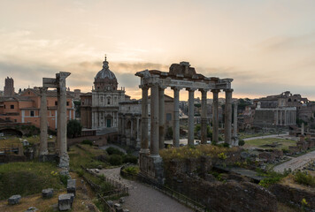 Sunrise landscapes of the empty Roman Forum, view of the Temple of Vespasian and Titus