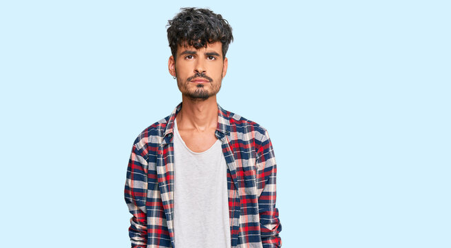 Young hispanic man wearing casual clothes depressed and worry for distress, crying angry and afraid. sad expression.