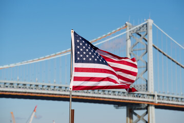 American flag on the background of the bridge