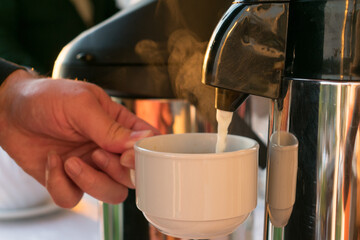 pouring coffee in a cup