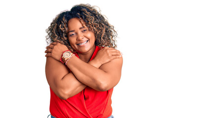 Young african american plus size woman wearing casual style with sleeveless shirt hugging oneself...