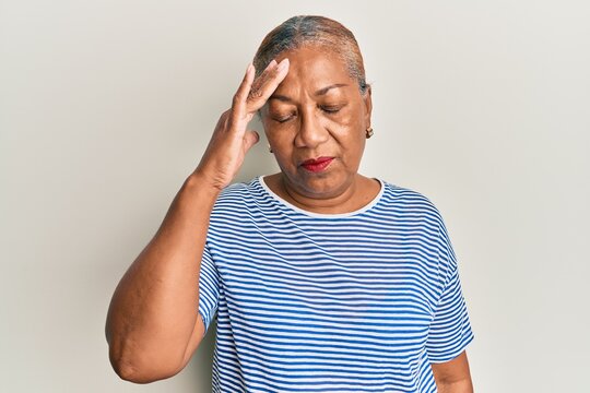 Senior african american woman wearing casual clothes surprised with hand on head for mistake, remember error. forgot, bad memory concept.