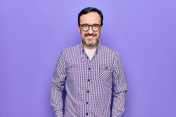 Middle age handsome man wearing casual shirt and glasses over isolated white background with a happy and cool smile on face. Lucky person.