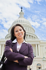 Beautiful mid adult Asian American woman in front of the U.S. Capitol building in Washington, DC