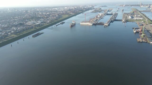 aerial of ship passing Ijmuiden Sluis, the largest sea ship lock in the world