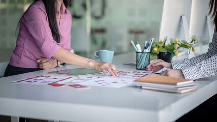 Fototapeta premium Group of young ui ux graphic designer people collaborating on project in office.