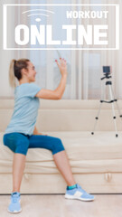 Naklejka premium image with text workout online and oriented for use on a smartphone. Happy young fitness instructor talking with clients through video call, Communication through instant messengers,