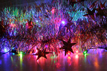 Colored lights spots of new year on a black background