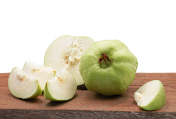 green guava on wooden board on white background