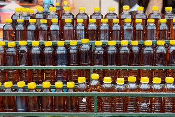 hair oil bottles in a row for sale