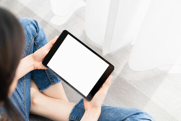Woman hand using digital tablet and the screen is blank.