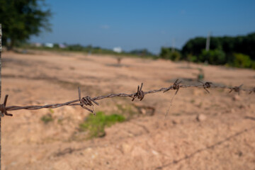 wire barbed sky  desert fence
