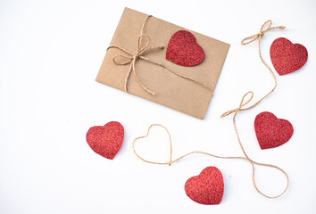 One envelope with many red heart. love Valentine day on 14th February. Send love letter, small gift, confession of love to beloved. craft envelope