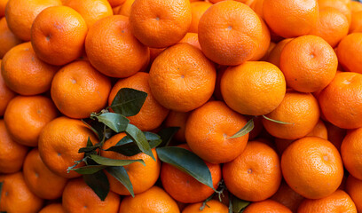 close up of fresh oranges in large quantity