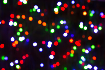 Festive Christmas lights background. Blurred pattern - bokeh with light.