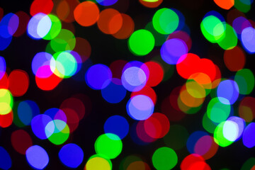 Festive Christmas lights background. Blurred pattern - bokeh with light.