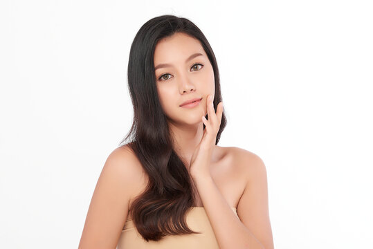 Beautiful Young asian Woman with Clean Fresh Skin, on Pink background, Face care, Facial treatment. Cosmetology, beauty and spa. Asian women portrait