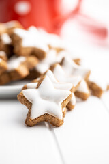 Icing gingerbread stars. Traditional Christmas cookies.